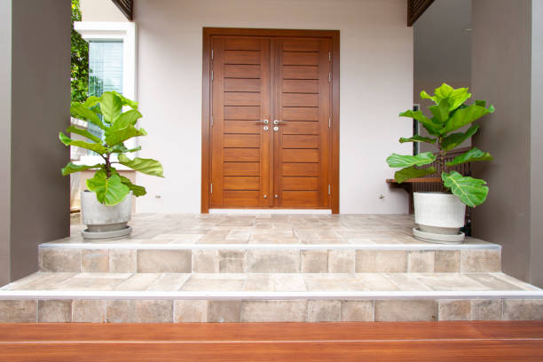 Main entrance of residential house with tiled floor and steps